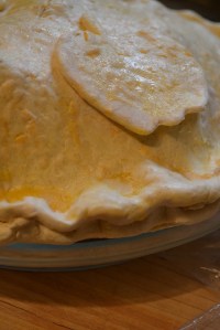 Frozen pie placed in pie plate for baking